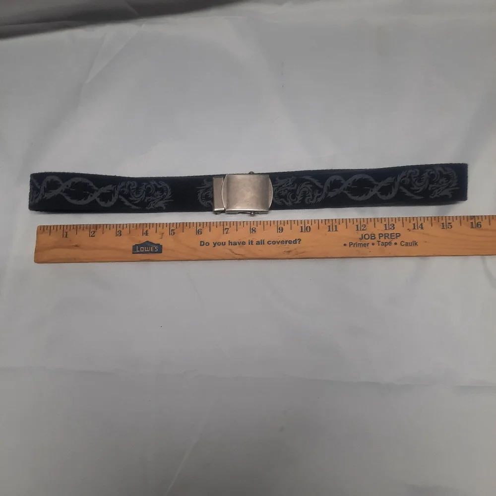 Reversible black belt, side 1 is black w/ grey dragons & side 2 is solid Black
